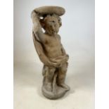 A reconstituted stone jardiniere statue of a cherub.