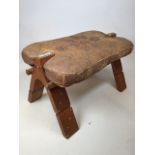 A camel stool with leather seat and stud detail with folding adjustable legs W:60cm x D:39cm x H: