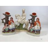 A collection of three Staffordshire flat back figures. Height of tallest 32cm