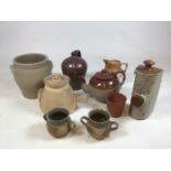 A collection of stoneware items including a stoneware teapot. Tallest item 23cm