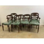 A set of eight Victorian mahogany balloon back dining chairs with reeded legs. To include two