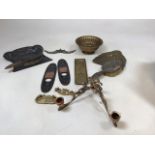 A collection of art nouveau copper and brass ornamental items including door trims, twin wall