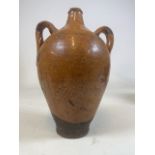 A Roman pottery amphora. W:24cm x D:19cm x H:33cm