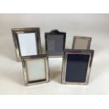 Two silver photo frames , largest W:13cm x H:19cm together with three silver plated frames