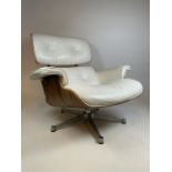 Charles Eames style lounge chair in rosewood with white leather upholstery. With aluminium five