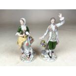 A pair of Sitzendorf, Dresden porcelain figures shepherd and sheperdess decoratively painted with