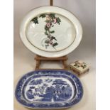 A large meat plate with bird design together with a willow pattern meat plate and a lidded pot