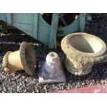 Three concrete parts for garden urns.