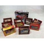 A collection of boxed Matchbox Models models of Yesteryear tighter with a Corgi Fozzie bear muppet