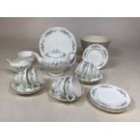 A Wedgwood tea set in Westbury design with teapot, saucer and sugar bowl, five tea cups and