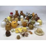 A collection of approximately forty assorted honey pots and honey related items including