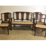 An inlaid Edwardian suite to include salon sofa and four inlaid chairs with fluted legs. Seat height