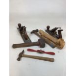 A selection of vintage tools including two planes and other items