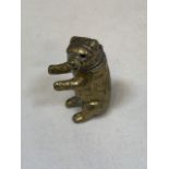 A small rearing bear with hinged head H:6cm