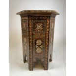 A hexagonal inlaid Moroccan drinks table. W:38cm x D:38cm x H:56cm