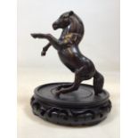 A bronze statue of a rearing horse on stand. Horse H:17cm