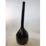 A black glazed earthenware bottle form vase W:30cm x H:96cm