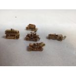 A collection of 9ct gold charms - transport interest. Including a double decker bus, three vintage