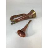 Brass and copper hunting horns - early twentieth century. Length of largest 28cm, smallest 22cm