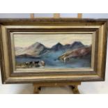 An oil on canvas of a lake and mountain scene signed A Adams in gilt frame. W:64cm x H:40cm