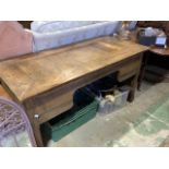 A French oak writing table W:143cm x D:69cm x H:73cm