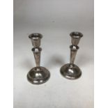 A pair of silver hall marked candlesticks - PP Ltd H:14cm