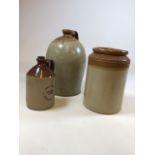 A Barnby & Staunton stoneware flagon together with a Perry Bros flagon and a jar H:36cm Tallest
