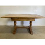 A Shapland and Petter arts and crafts mid century golden oak extending dining table. Extended W: