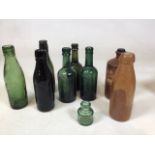 A collection of glass bottles including Kerswell beer bottles, Starkey Knight and Ford, a