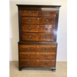 A 19th century flame mahogany chest on chest. Top with two short over three long drawers base with