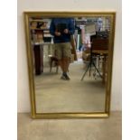 A large modern bevelled mirror in gilt frame.W:99cm x H:128cm