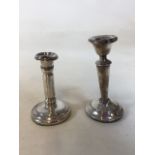 Two silver candles sticks - hallmarked tallest being 14cm