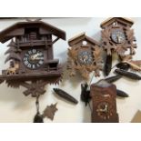 Cuckoo clocks. Black Forrest style and others also with weights.