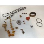 A collection of costume jewellery some gold plated and yellow metal items and two silver christening