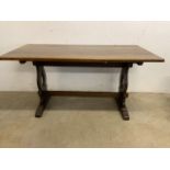 A solid oak dining table with double stretcher bars and four pegs. W:150cm x D:75cm x H:75cm