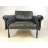 A leather Ateljee armchair by Yrjo Kukkapuro for Haimi. A black leather Ateljee armchair design by