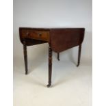 A Mahogany Pembroke table. Brass castors and inlaid detail. W:56cm x H:71cm
