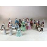 A large collection of figurines including Royal Doulton Christmas Morn, Royal Worcester Rebecca,