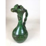A green glazed Chanakkale (Western Turkey) pottery ewer, 19th century, with rope twisted handle