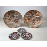 A pair of oriental charger (one repaired) together with three plates - characters to reverse