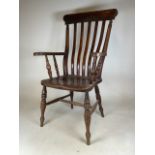 An elm seated Victorian grandfather chair. Signs of woodworm. Seat height H:46cm