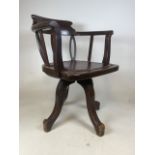 An early 20th century swivel desk chair with leather seat with studded finish.Seat height H:46cm