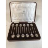 A boxed set of twelve bean spoons hallmarked Sheffield 1936, Walker & Hall. Approx weight