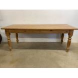 A Large 20th century pine farmhouse table. W:213cm x D:83cm x H:78cm