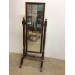 A large modern stained pine cheval mirror. W:63cm x H:163cm