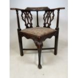 A Victorian carved corner chair with drop ion seat. (A.F)W:57cm x D:70cm x H:78cm