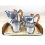 A 1950s Picquot ware tea and coffee pot also with a milk jug, sugar pot and tray.