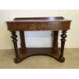 A Small mahogany wash stand with central drawer and curved base with turned and fluted legs. W: