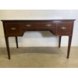 A Maple and Co inlaid mahogany desk with central drawer flanked by two deep drawers. Maple and co