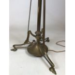 An art nouveau brass extendable standard lamp H:140cm